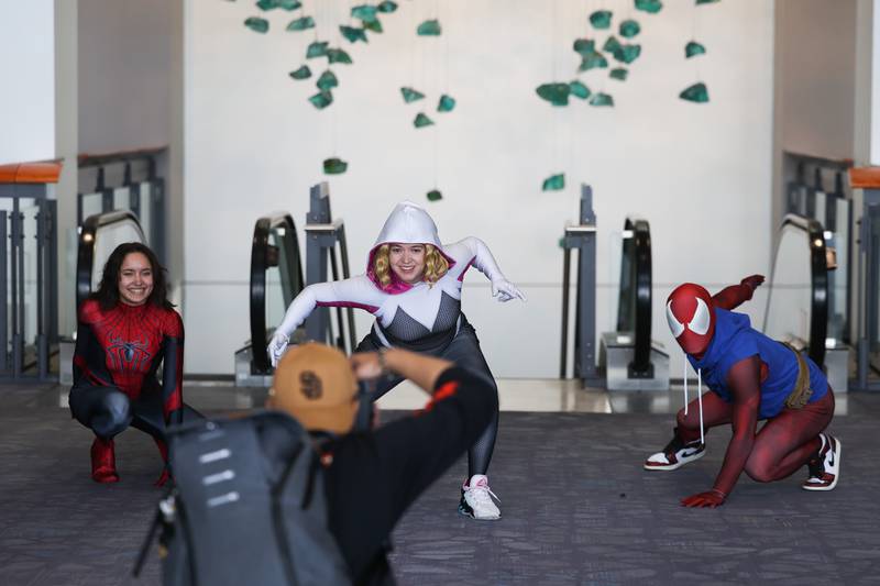 Cosplayer, dressed as characters from the Spider-Man universe, poses for a photo at C2E2 Chicago Comic & Entertainment Expo on Sunday, April 2, 2023 at McCormick Place in Chicago.