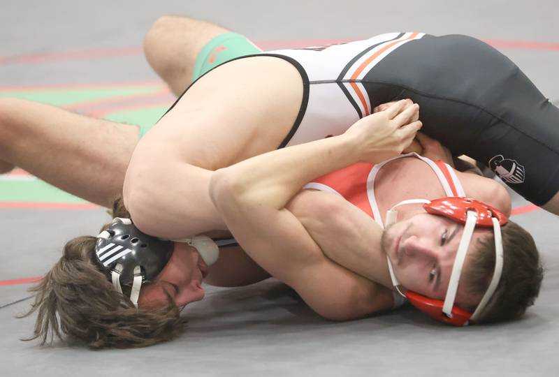 Kaneland's Colton Heltskey wrestles L-P's Avery Scorelo during a meet on Thursday, Jan. 22, 2026 in Sellett Gymnasium at L-P High School.