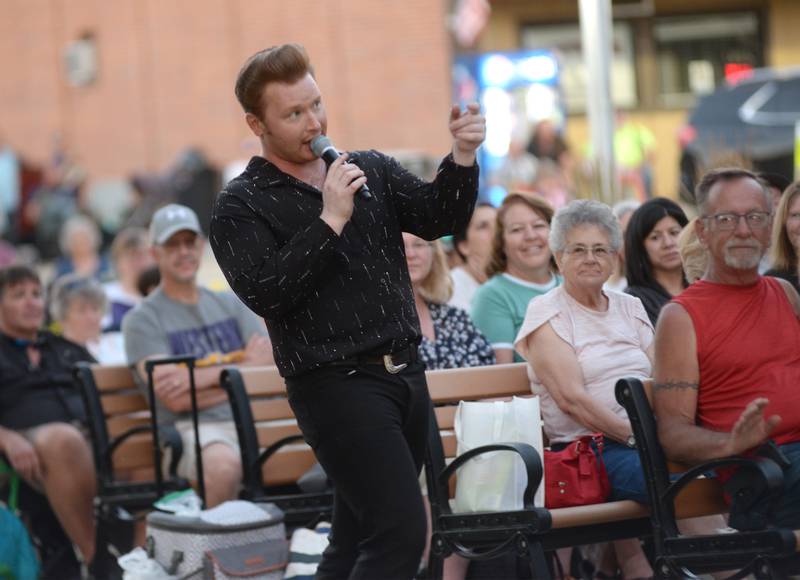 Jonny Lyons sings as he mingles with the crowd at the Mt Morris Jamboree on Friday, June 27, 2025. The Jonny Lyons and Pride concert drew an estimated crowd of 1,000 to downtown Mt. Morris.