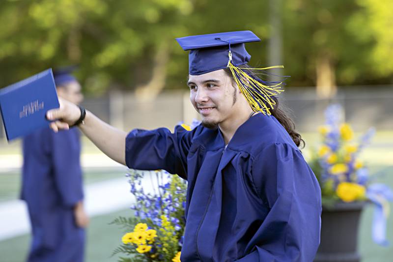 Phoenix Cantu celebrates after getting his diploma during commencement at Sterling High School Friday, May 26, 2023.