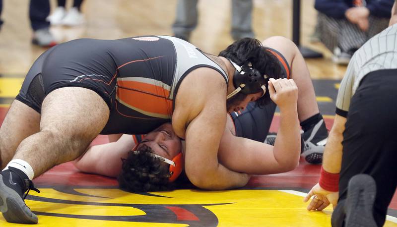 CJ Relias of Buffalo Grove wrestles Jesse Saavedra of McHenry at 285 pounds during the Batavia wrestling invite Saturday January 14, 2023 in Batavia.