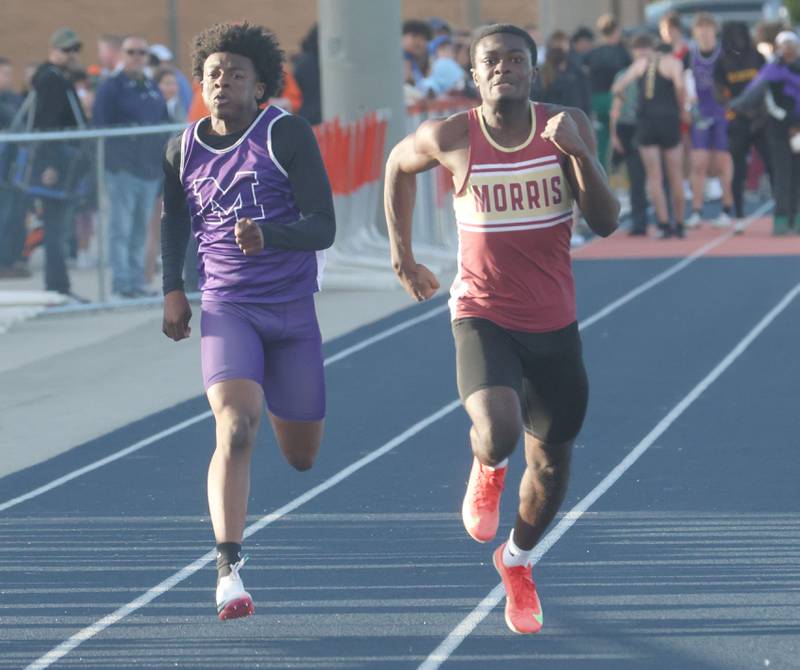 Manteno's Jeremiah Alexander and Morris's Spencer Osafo run the 100 meter dash during the Class 2A Sectional on Wednesday, May 20, 2026 at Pontiac High School.