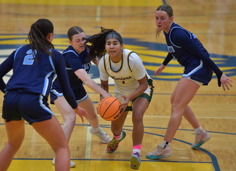Waubonsie Valley’s Arianna Garcia-Evans is surrounded by Nazareth’s Samantha Austin (2), Molly Moore, and Lyla Shelton  (right) during the Class 4A Lyons Supersectional game on March 2, 2026 at Lyons Township High School in LaGrange.