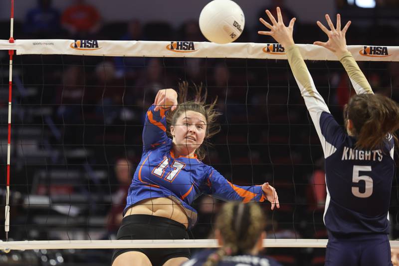 Genoa-Kingston’s Lily Mueller powers a shot against IC Catholic in the Class 2A championship match on Saturday in Normal.