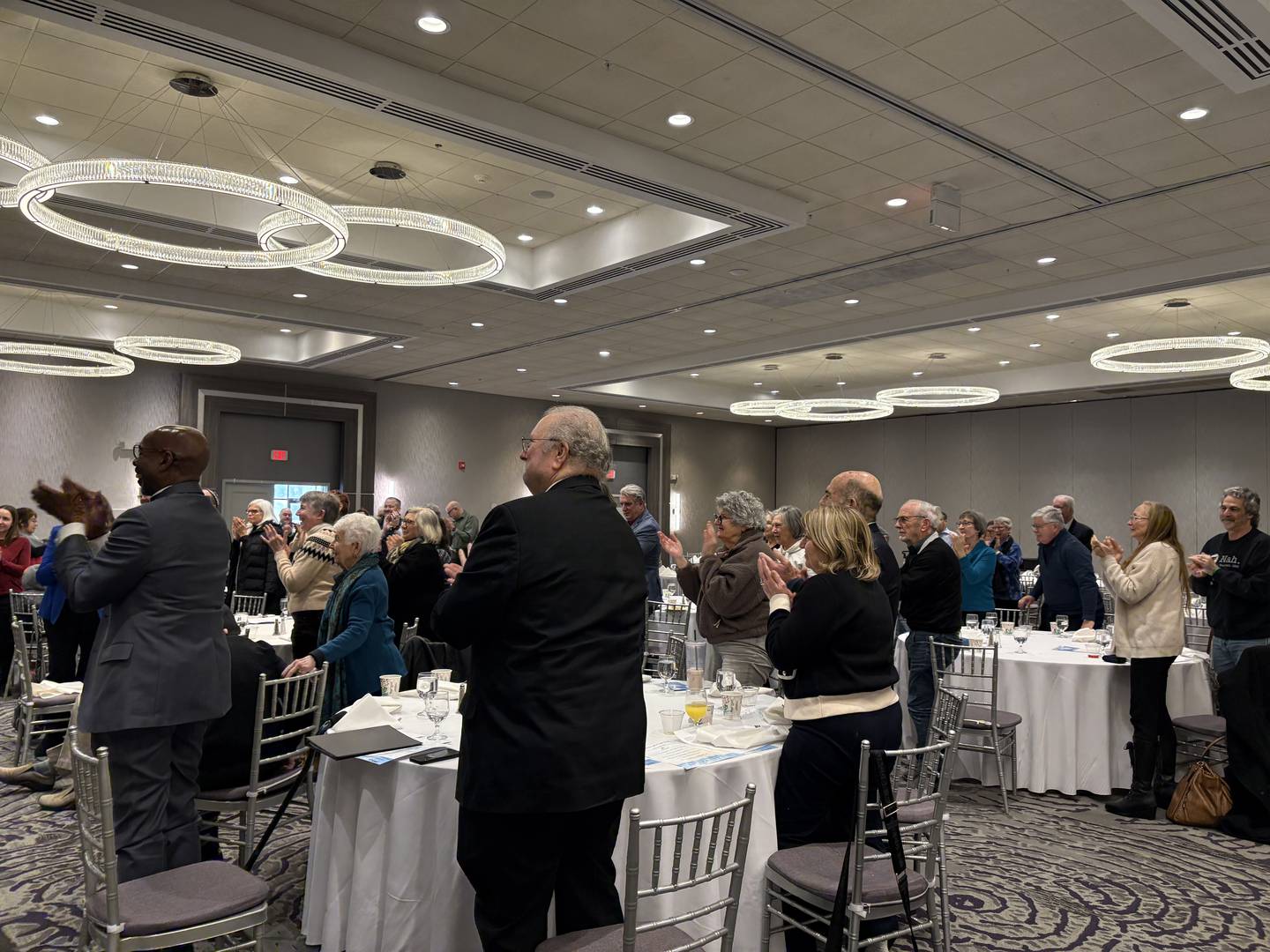 Audience members applaud singer Darlene Benton at the FaithBridge Martin Luther King Jr. prayer breakfast in Crystal Lake Jan. 19, 2026.