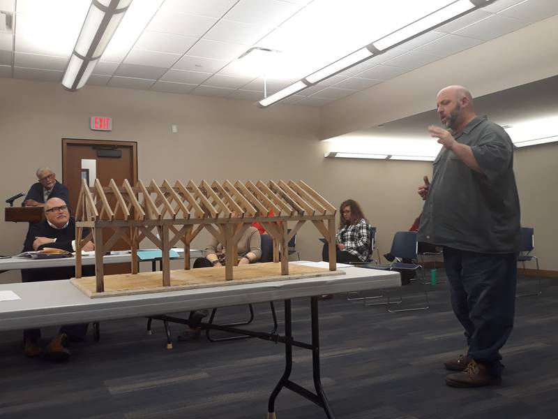 Streator High School vocational instructor David Taylor (right) explains to the Streator City Council on Tuesday, April 12, 2022, how the proposed picnic pavilion at Marilla Park in Streator would be constructed by his students.