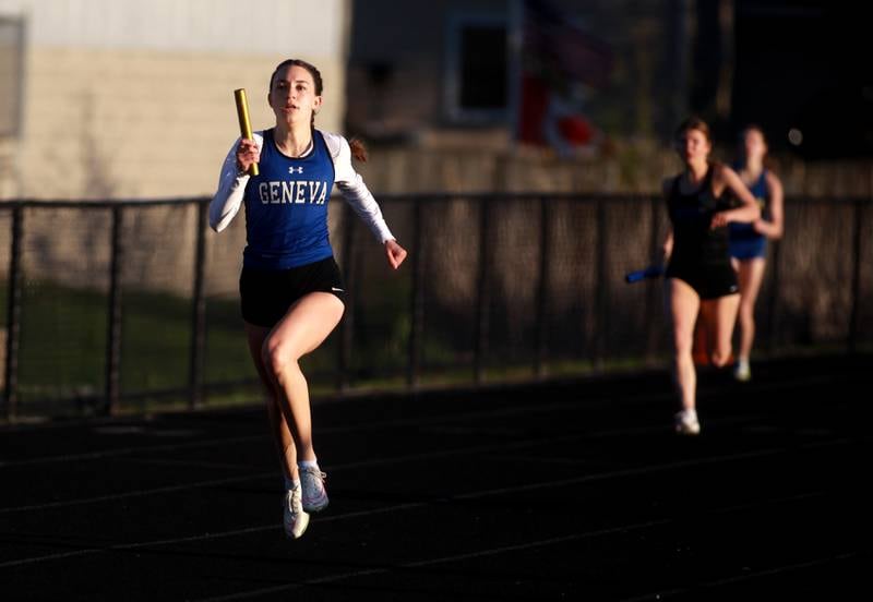 Geneva’s Alyssa Golden runs the third leg of the 4x200-meter relay during the DuKane Conference Girls Outdoor Championship on Thursday, May 8, 2025 at Glenbard North in Carol Stream.