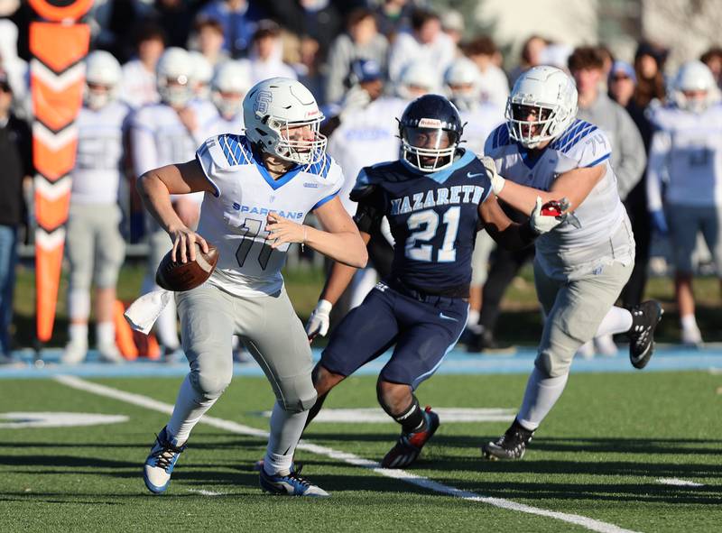 St. Francis' Alessio Milivojevic (11) scrambles against the Nazareth defense during the boys varsity IHSA 5A semifinal between Nazareth Academy and St. Francis high school in La Grange Park, IL on Saturday, Nov. 18, 2023.