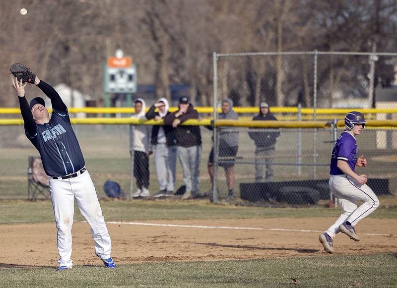 Aidan Love of Rockford Guilford pulls in a pop fly against Dixon Monday, March 20, 2023.