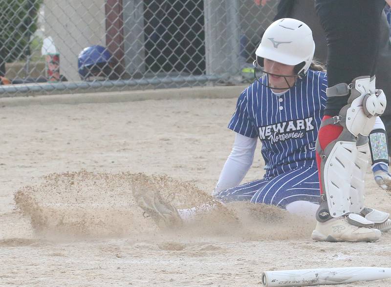 Newark's Cayla Pottinger slides in safely to home plate against Earlville during the Class 1A Regional final on Thursday, May 22, 2025 at Indian Creek High School in Shabbona.