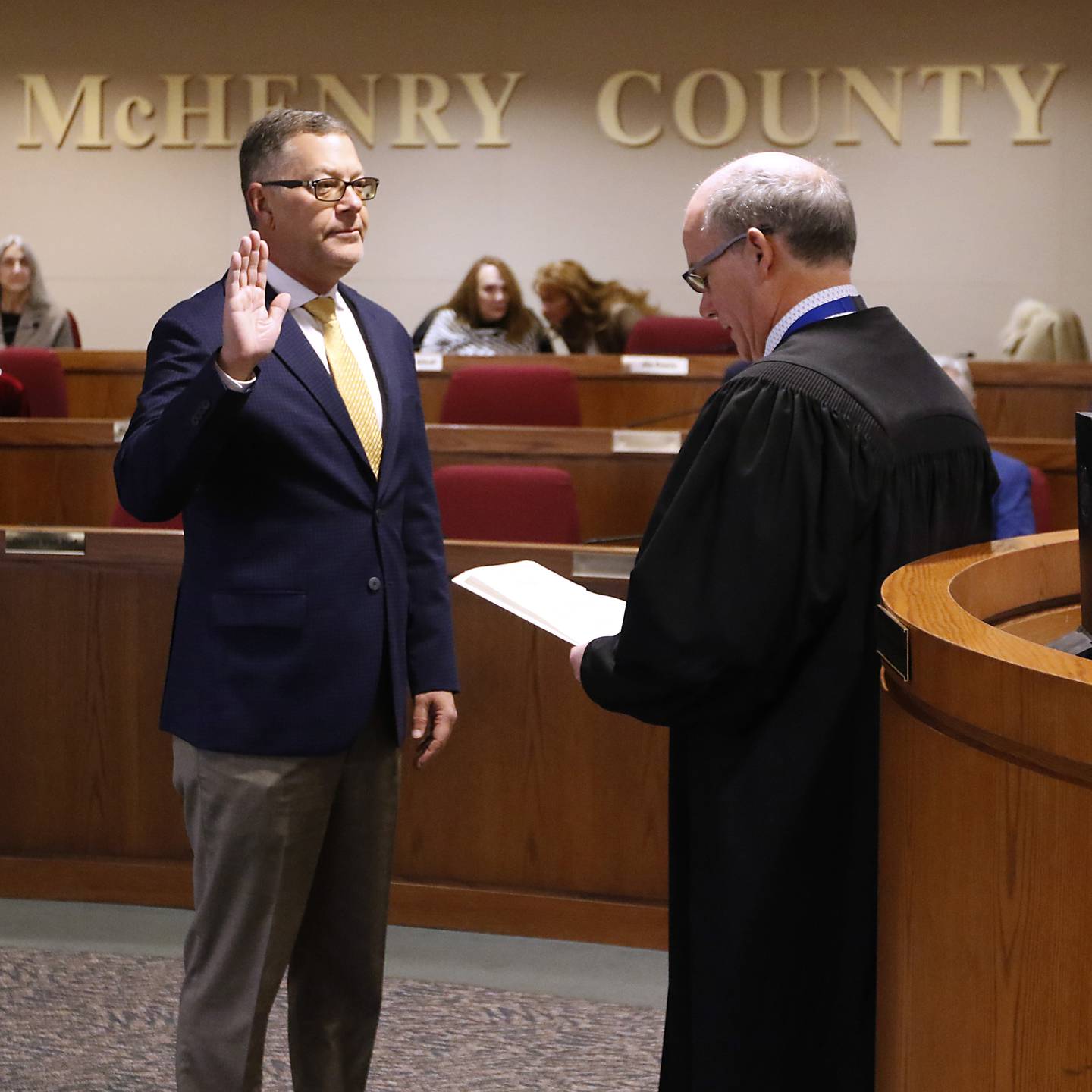 McHenry County Chief Judge Michael Feetterer administers the oath of officer to the recently elected members of the McHenry County Board on Monday, Dec. 2, 2024, at the McHenry County Administration Building in Woodstock. Sworn in were new members Pat Sullivan, R-Algonquin; John Collins, D-Crystal Lake; Deena Krieger, R-Island Lake; and Paul Thomas, R-Wonder Lake;l along with County Board Chair Mike Buehler and members Eric Hendricks, Mike Shorten, Carl Kamienski, Tracie Von Bergen and Jim Kearns were sworn in for another term.