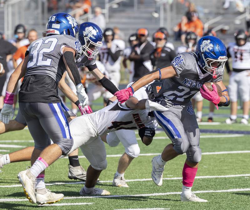 Newman’s Rylan Alvarado fights through tackles against Kewanee Saturday, Oct. 18, 2025.