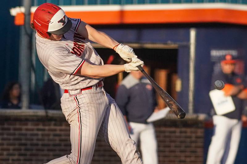 Yorkville's Nate Harris (15) hits a grand slam against Oswego during a baseball game at Oswego High School in April 2024.