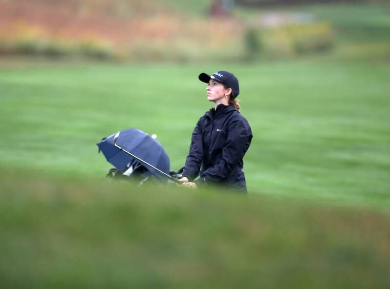 Wheaton Warrenville South’s Abby Olson hits from the fairway during the DuKane Conference Girls Golf Championship on Tuesday, Sept. 24, 2024 at Phillips Park Golf Course in Aurora.