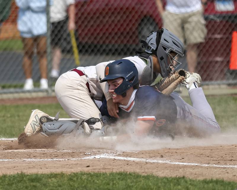 Oswego's Dylan King (20) is blocked at the plate and is called out during Class 4A Plainfield North Regional final baseball game between Oswego at Plainfield North. Saturday, May 31, 2025 in Plainfield.