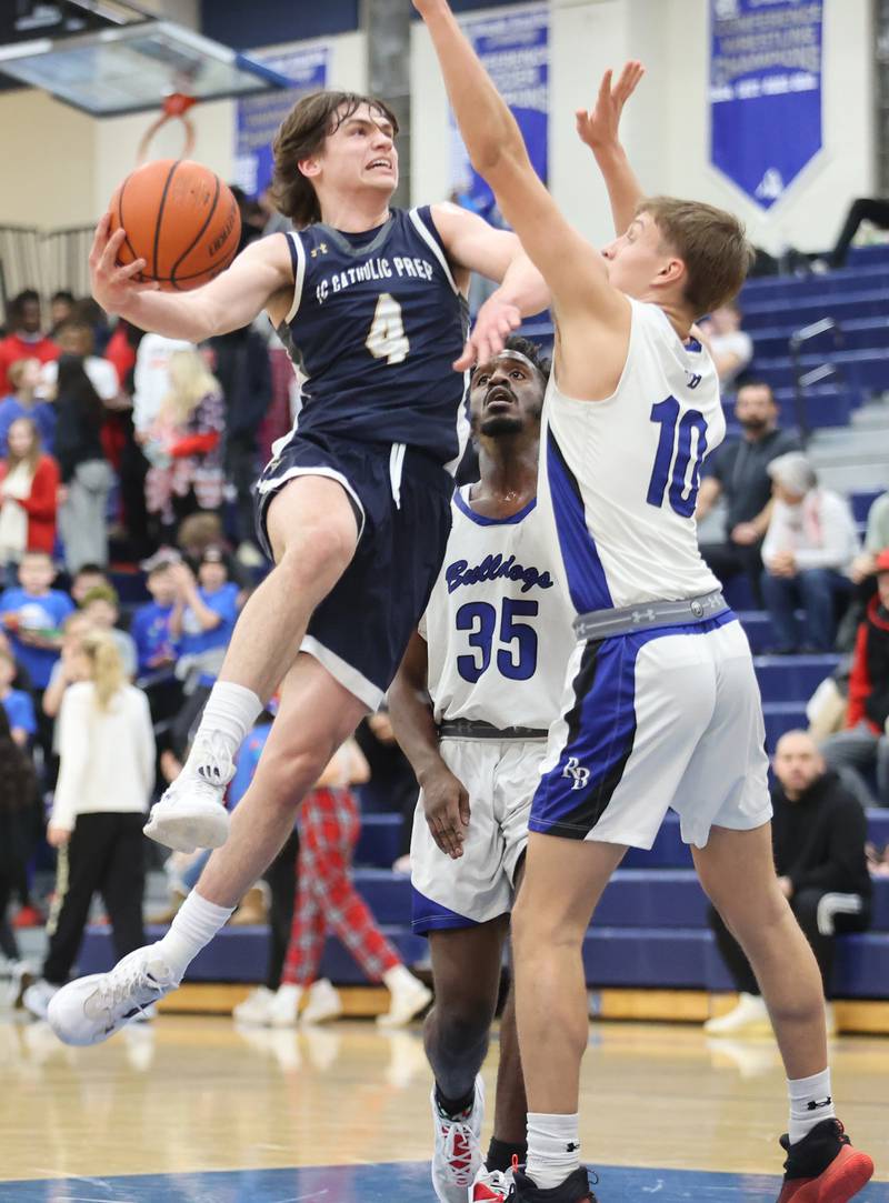 ICCP's Dean O'Brien (4) drives to the basket during the boys varsity basketball game between IC Catholic Prep and Riverside Brookfield in Riverside on Tuesday, Jan. 24, 2023.
