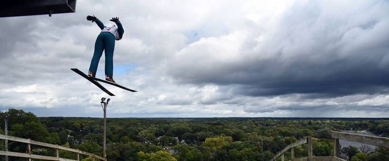 A jumper leaps high above Fox River Grove on Sunday, Sept. 25, 2022, during the Norge Ski Club's annual Fall Ski Jumping Competition, also known as Jumptoberfest.