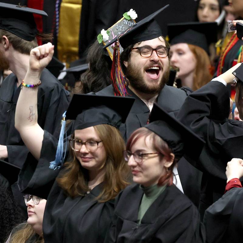 Northern Illinois University candidates for graduation celebrate during the first of two undergraduate commencement ceremonies Saturday, May 11, 2024, in the Convocation Center at NIU in DeKalb.