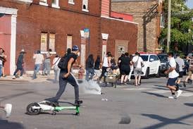 Using helicopters and chemical agents, immigration agents become increasingly aggressive in Chicago