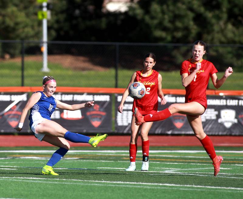 (Left to right) Geneva's Riley Pryor kicks the ball as it’s blocked by Batavia's Emma Wecker during a Tri-Cities Soccer Night game on Tuesday, April 29, 2025 at St. Charles East.
