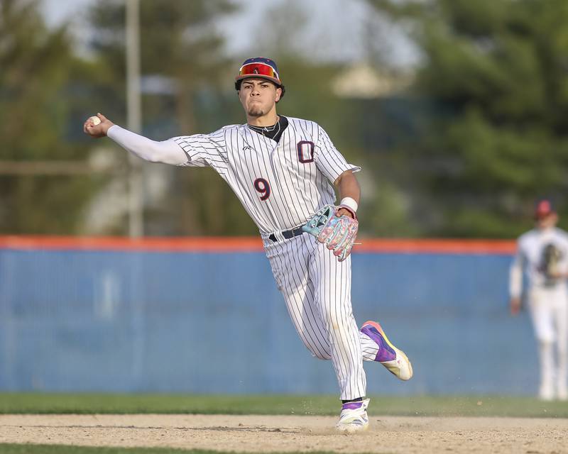 Oswego's Gabe Herrera (9) throws to first during baseball game between Plainfield North at Oswego, Thursday, April 24, 2025 in Oswego.