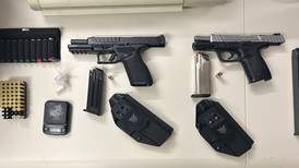 Illegal drugs, guns seized in separate house searches; 2 charged with multiple felonies, Aurora police say 