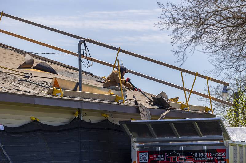 TCS, Total Construction Services of Sterling, work on the roof of the Twin Cities Homeless Shelter on Friday, April 19, 2024 in Sterling.