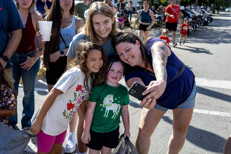 Jen Terry takes a selfie with her daughter and nieces during during the Grundy County Corn Festival Parade in Downtown Morris on Sept. 28, 2025.