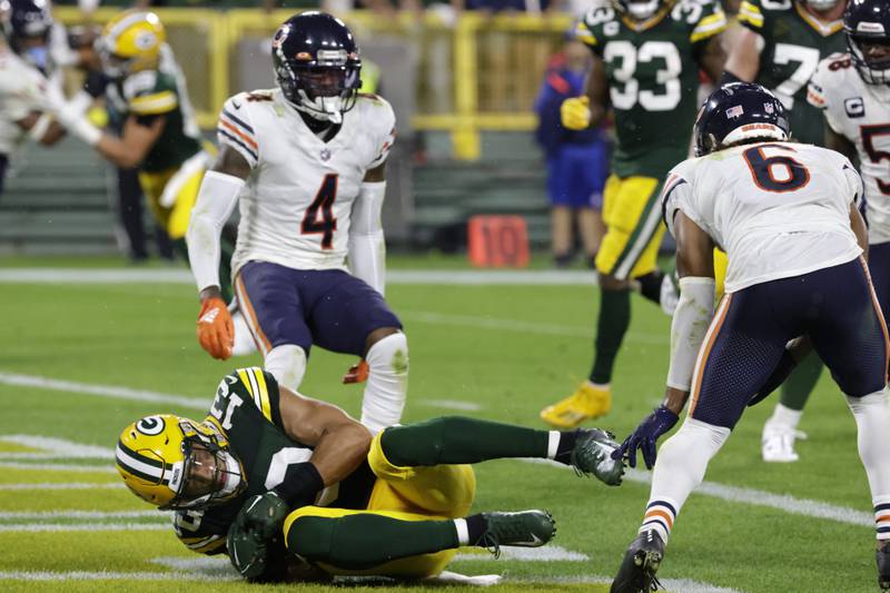 Green Bay Packers wide receiver Allen Lazard catches a 5-yard touchdown pass between Chicago Bears safety Eddie Jackson, left, and cornerback Kyler Gordon during the first half, Sunday, Sept. 18, 2022, in Green Bay, Wis.