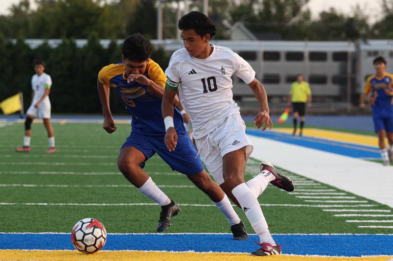 Joliet Catholic’s Diego Rios works past Joliet Central’s Ramiro Vargas on Monday, Sept. 9, 2024 in Joliet.