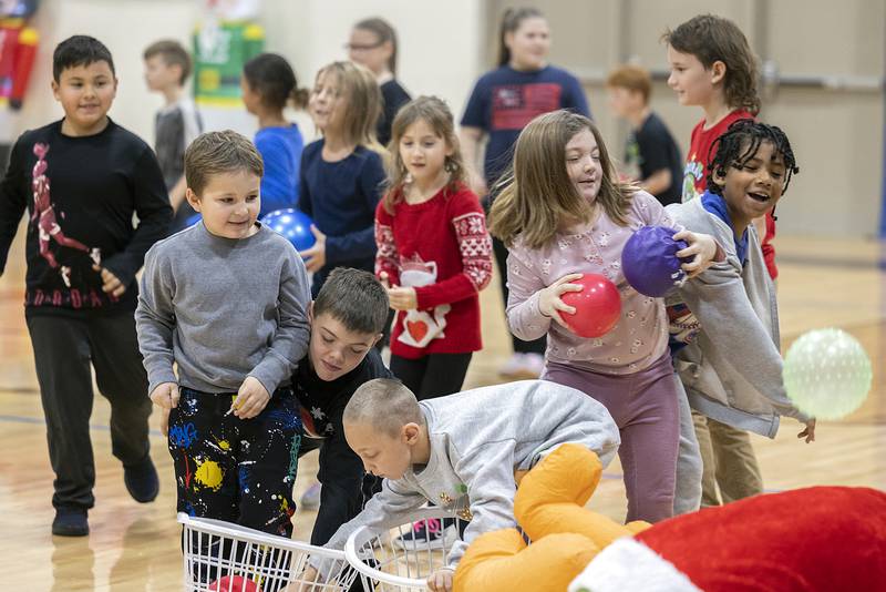Kids scramble to grab ammo against the green menace Saturday, Nov. 23, 2024, in Rock Falls.