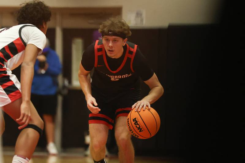 Bolingbrook’s Trey Brost looks for a play against Benet in the Class 4A Bolingbrook Sectional championship game on Friday, March 6, 2026 in Bolingbrook.