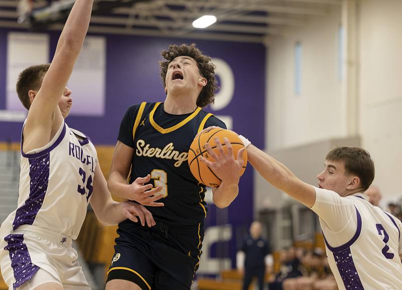 Sterling’s Brady Berlin is fouled by Rochelle’s Van Gerber Saturday, Jan. 3, 2026.