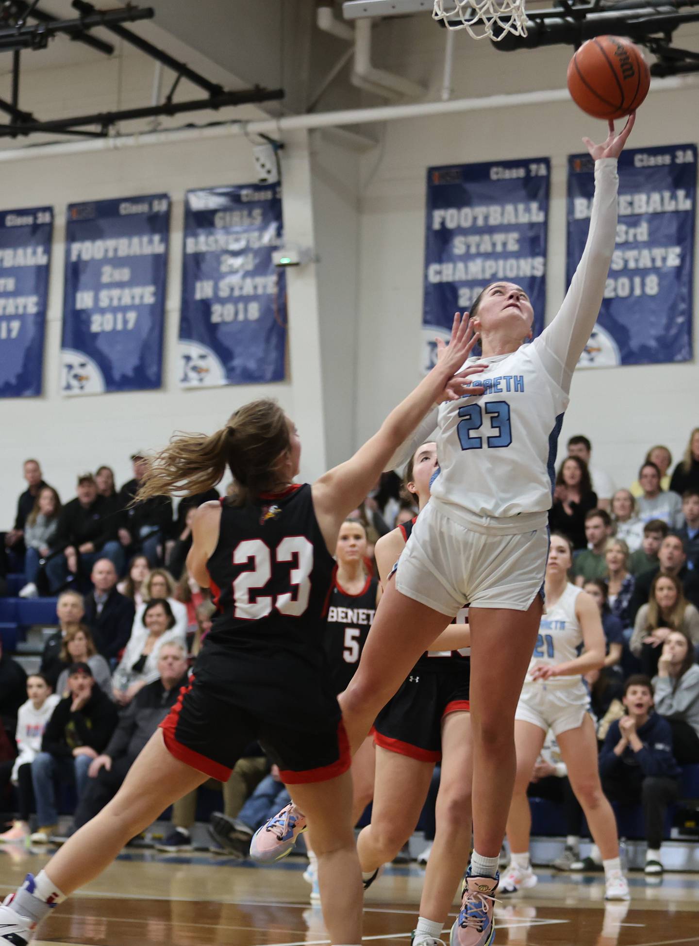 Nazareth's Danielle Scully (23) takes it to the basket during the girls varsity basketball game between Benet and Nazareth academies on Wednesday, Jan. 3, 2023 in La Grange Park, IL.
