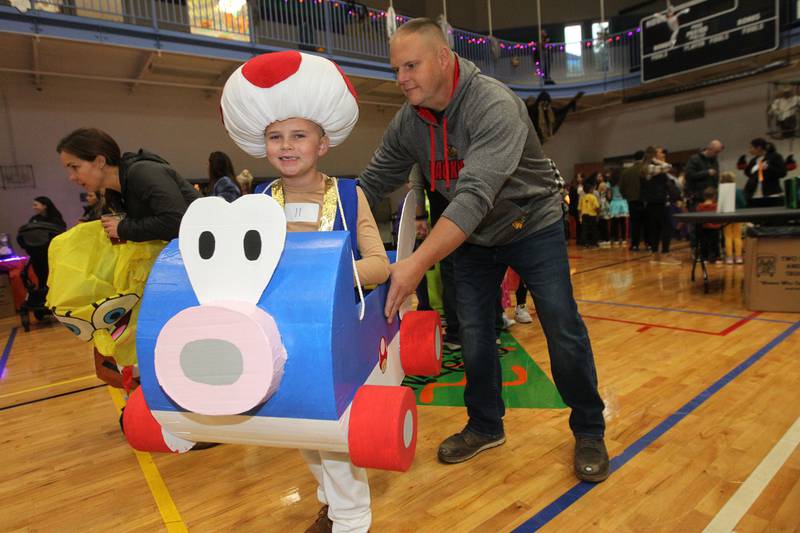 Kayden Link, 8, of Gurnee gets some help from his father, Larry, with his Super Mario Bros. costume during Witchy Thrills & Chills at the Lindenhurst Park District Lippert Community Center on October 14th in Lindenhurst.
Photo by Candace H. Johnson for Shaw Local News Network