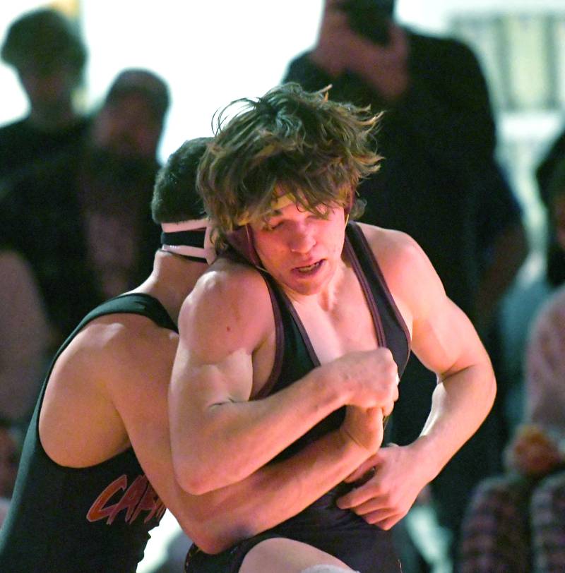 Richmond Burton's Brody Rudkin tries to escape from Stillman Valley's Aiden Livingston during the championship match at 145 pounds at the 1A Oregon Wrestling Sectional on Saturday. Livingston won the match, but both wresetlers advance to the state finals.