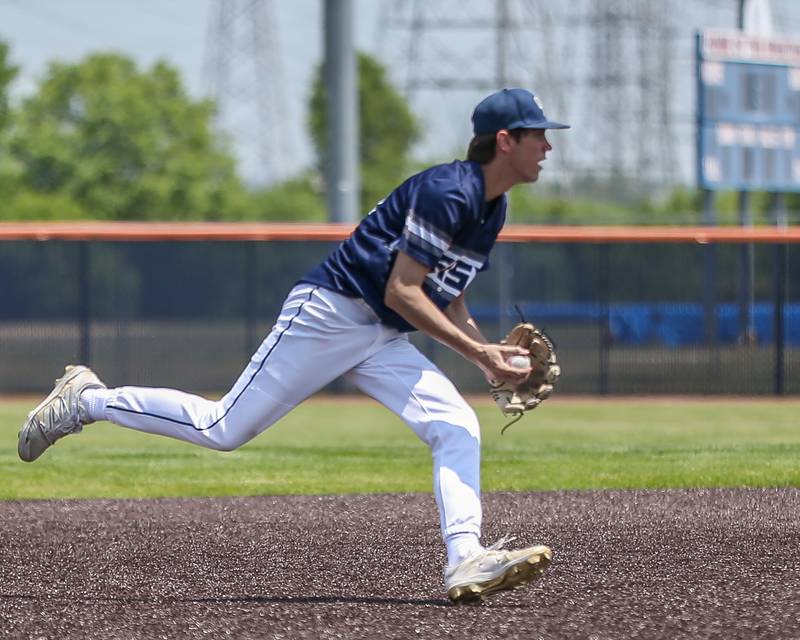 Oswego East's Mason Blanco (23) comes up with a grounder during Class 4A Romeoville Sectional final game between Oswego East at Oswego.  June 3, 2023.