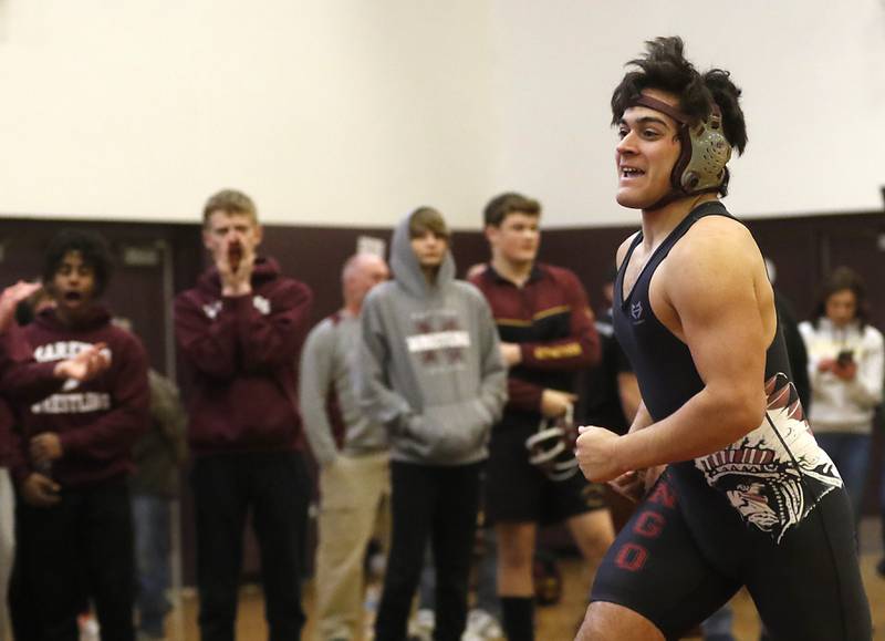 Marengo’s Eddie Solis celebrates his win over Genoa-Kingston’s Julian Torres their 195-pound championship wrestling match in the IHSA 1A Richmond-Burton Wrestling Regional Thursday, Jan. 19, 2023, at Richmond-Burton High School in Richmond.
