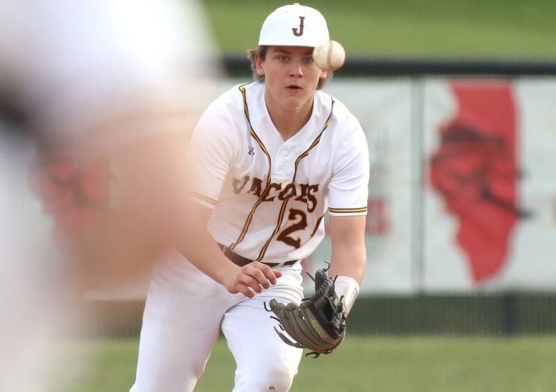 Jacobs’ Andrew Deegan fields in infield chopper in varsity baseball Wednesday at Huntley.