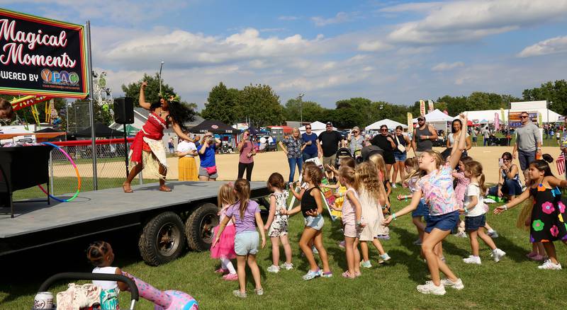 Moana gives kids a dance lesson on the Magical Moments Stage at Yorkville's Hometown Days festival at Beecher Community Park at 908 Game Farm Road, Yorkville on Saturday, Aug. 30, 2025.
