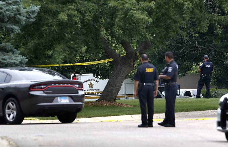 Officers from the McHenry County Sheriff and other departments investigate a domestic incident in which four people were killed on Wednesday Aug. 9, 2023, in the 5800 block of Wild Plum Road in unincorporated Crystal Lake. Police later said they were family members.