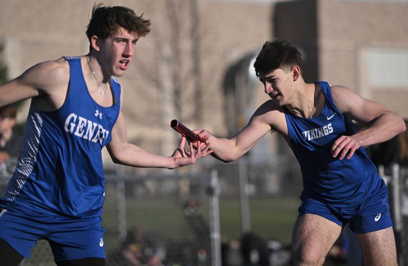 Geneva’s Brian Waters, right, and Ben Barton struggle with their handoff in the 800-meter relay at the Les Hodge Boys Track and Field Invitational at Batavia High School on Friday, April 5, 2024.