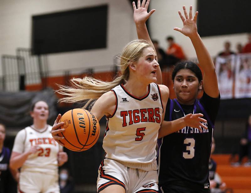 Crystal Lake Central's Ruby Macke drives to the basket against Hampshire's Jiselle Lopez during a Fox Valley Conference basketball game on Friday, Feb. 7, 2025, at Crystal Lake Central High School.