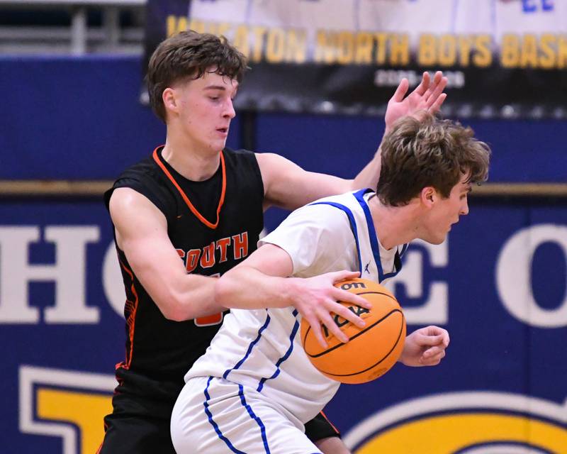Wheaton North's Ben Gillmar, right, tries to get around Wheaton Warrenville South's Reece Franks (5) during the game on Friday Feb. 6, 2026, held at Wheaton North High School.