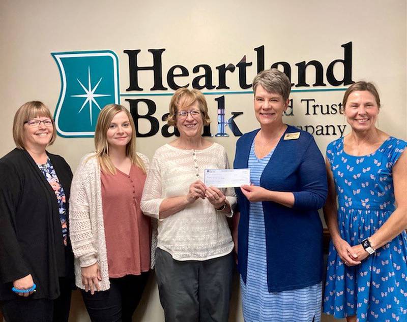 Heartland Bank employees Diana Dye, Rhiley Wallace, Sara Hudson and Kathy Hermeyer recently presented $375 donation to Vanessa Hoffeditz, director of the Bureau County Food Pantry.