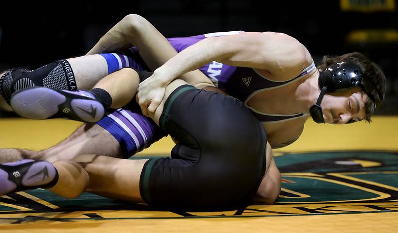 Hampshire’s Mike Brannigan controls Crystal Lake South’s Gavin Hastings during the 157-pound match of a Fox Valley Conference wrestling meet on Thursday, Jan. 15, 2026, at Crystal Lake South High School.