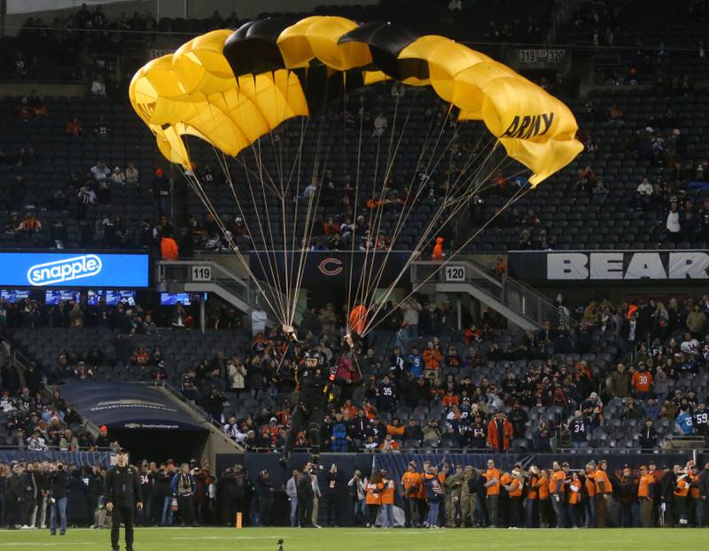 An US. Army Parchute Team skydiver lands on Soldier Field before the game between the Chicago Bears and Carolina Panthers on Thursday, Nov. 9, 2023 in Chicago.