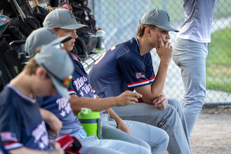 Hunter Sale of Illinois District 20 react in the dugout on Saturday, July 12, 2025 at Washington Park in Peru.