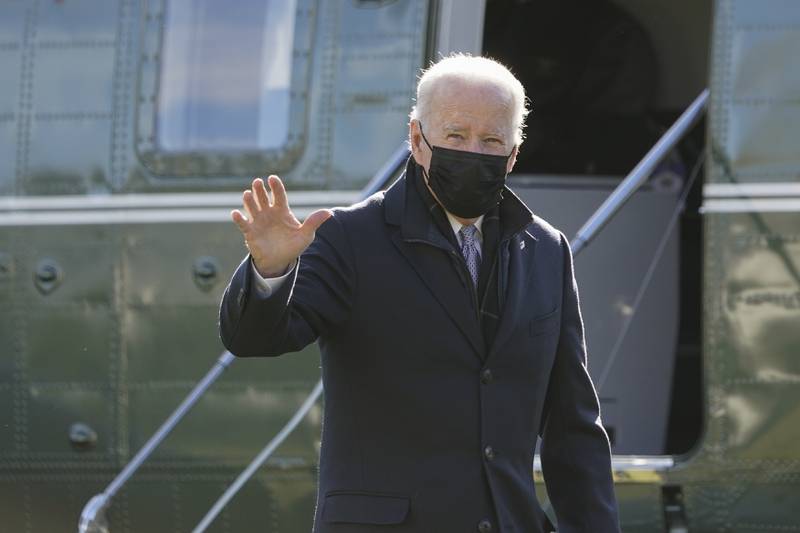 President Joe Biden walks to the Oval Office of the White House after stepping off Marine One, Monday, Jan. 10, 2022, in Washington. Biden is returning to Washington after spending the weekend at Camp David. (AP Photo/Patrick Semansky)