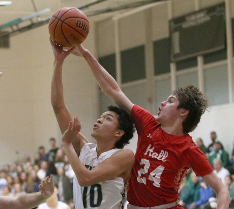 Hall's Kylan Smith (right) knocks the ball loose over St. Bede's Isiah Hart (left) on Monday, Dec. 14, 2022 at St. Bede Academy.
